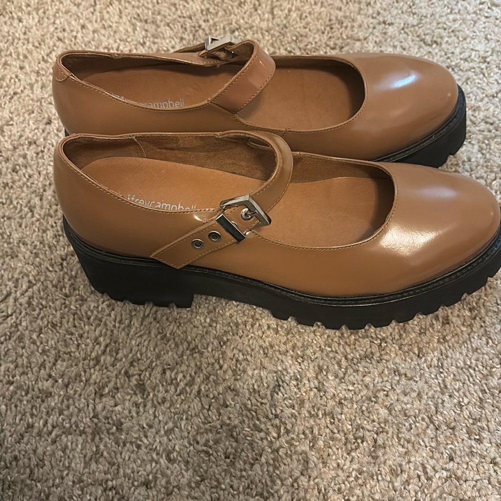 Lightly worn tan/brown platform Mary Jane’s. Brand is Jeffrey Campbell.